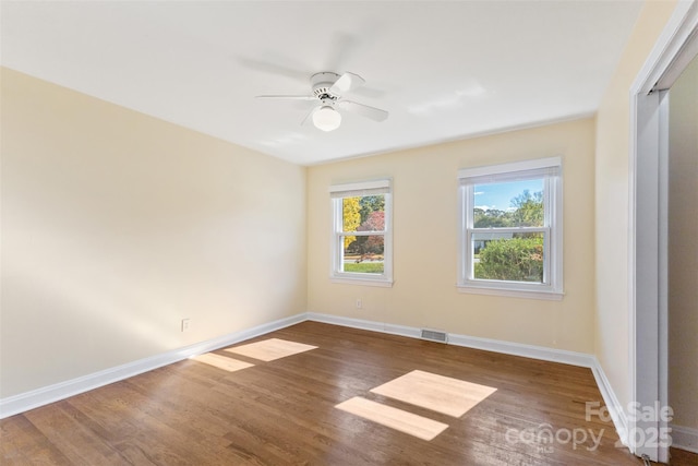 unfurnished room with wood-type flooring and ceiling fan