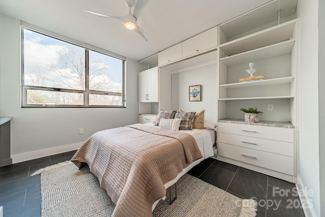 tiled bedroom featuring ceiling fan