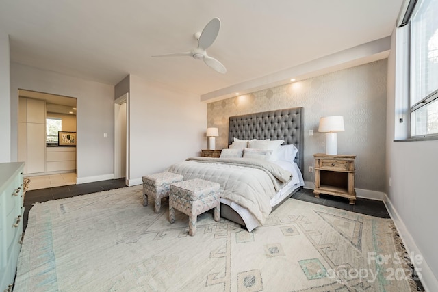 tiled bedroom featuring ceiling fan