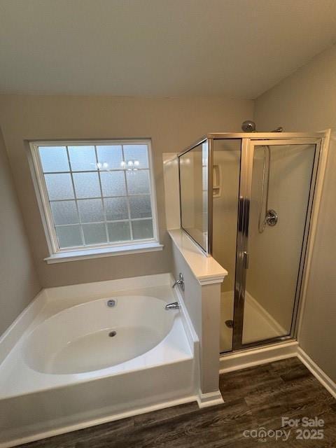 full bathroom with a garden tub, wood finished floors, and a stall shower