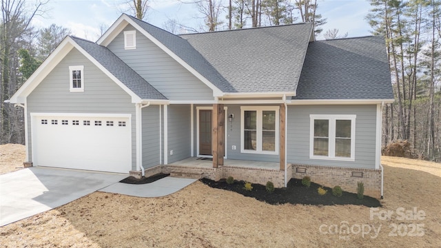 view of front facade with a porch and a garage