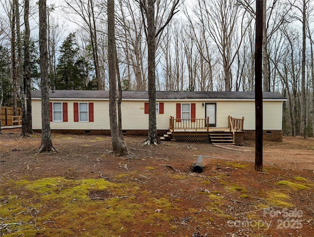 manufactured / mobile home featuring a wooden deck