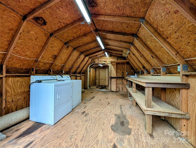 attic featuring washer and clothes dryer