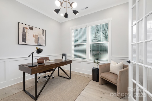 office area featuring an inviting chandelier and light wood-type flooring