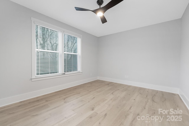 unfurnished room with light wood-type flooring and ceiling fan