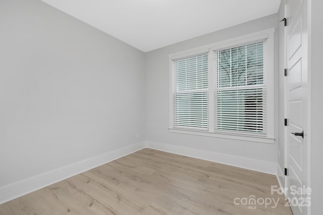 unfurnished room featuring light wood-type flooring