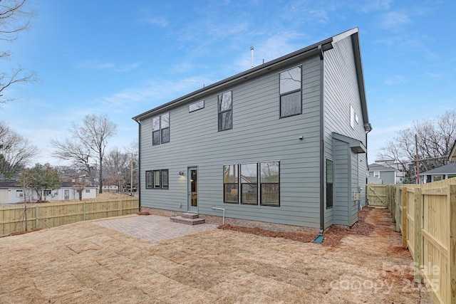 rear view of property featuring a patio area