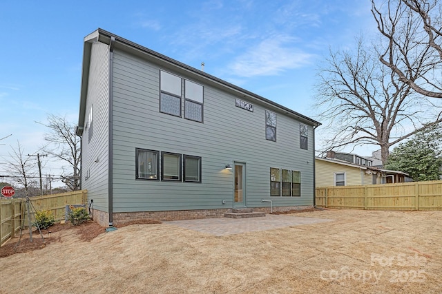 rear view of property featuring a patio