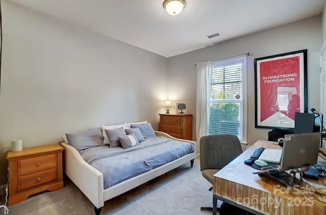 carpeted bedroom with visible vents