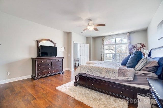 bedroom with baseboards, dark wood finished floors, and a ceiling fan