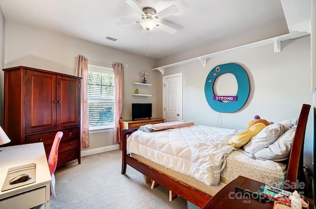 bedroom with baseboards, ceiling fan, visible vents, and light colored carpet