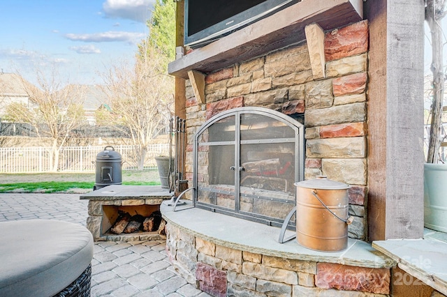 exterior details with stone siding and an outdoor stone fireplace