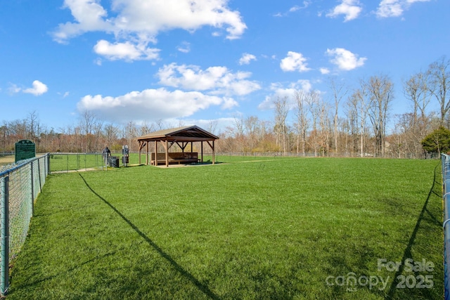 view of yard featuring fence and a gazebo