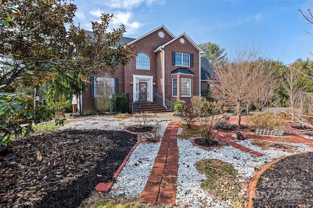 view of front of home featuring brick siding