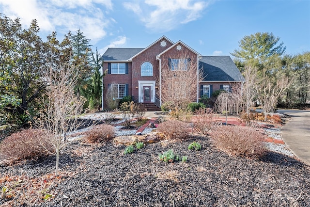 view of front of home with brick siding