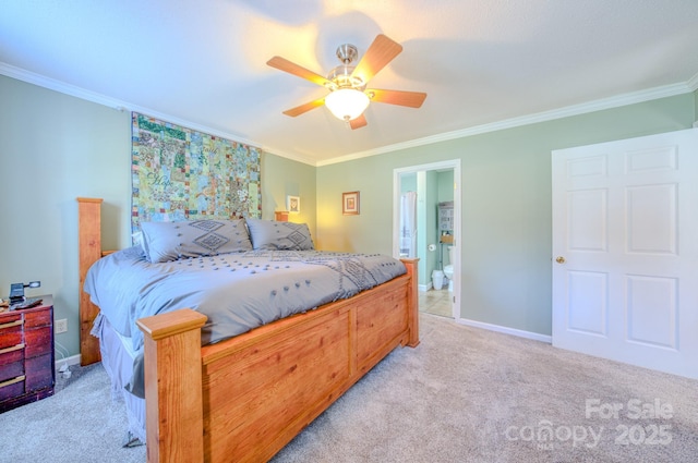 bedroom featuring ensuite bath, ornamental molding, light colored carpet, and ceiling fan