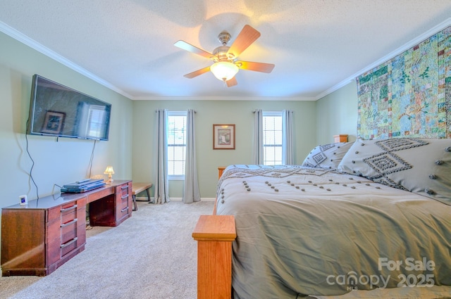 carpeted bedroom featuring crown molding, ceiling fan, and a textured ceiling