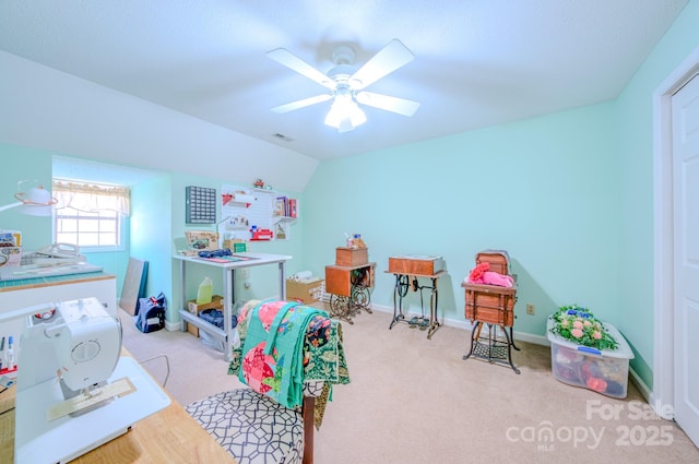 playroom with vaulted ceiling, light carpet, and ceiling fan