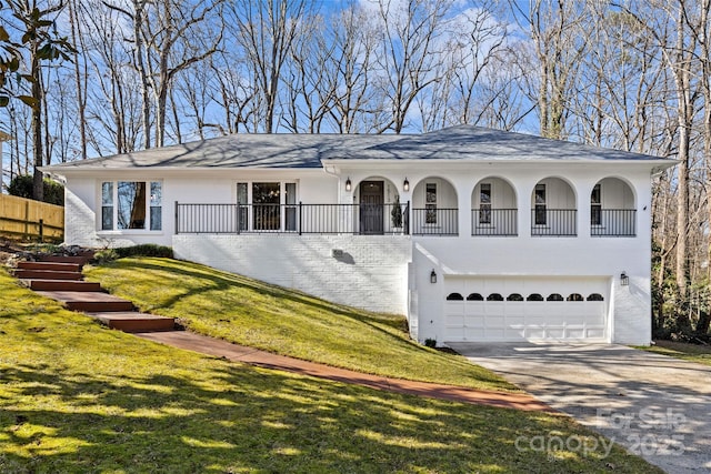 view of front of property with a garage and a front yard