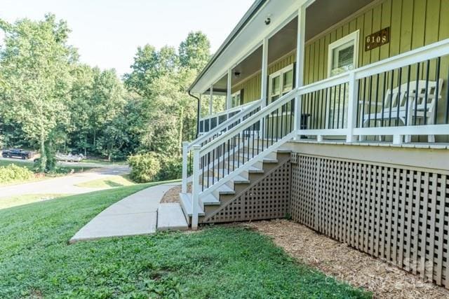 6108 Gold Creek Estate Dr, Hickory, NC 28601 - view of side of property with a yard, board and batten siding, and view of wooded area