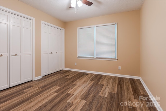 6108 Gold Creek Estate Dr, Hickory, NC 28601 - unfurnished bedroom with wood finished floors, two closets, and ceiling fan