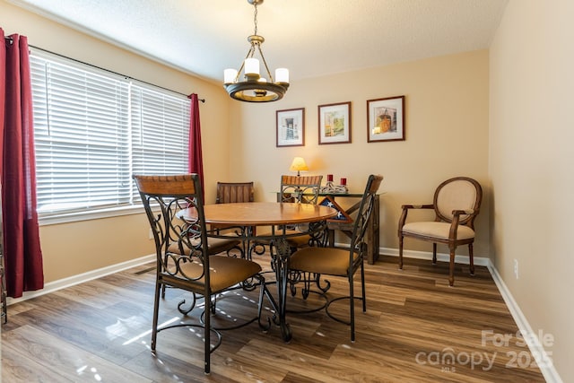 6108 Gold Creek Estate Dr, Hickory, NC 28601 - dining space with wood finished floors, a chandelier, and a textured ceiling