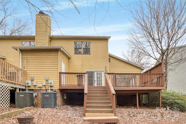 rear view of house featuring a deck and central air condition unit