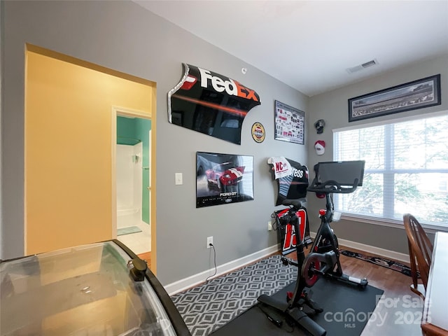 workout area featuring hardwood / wood-style floors