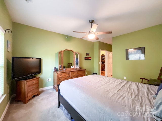 bedroom featuring ceiling fan and light carpet