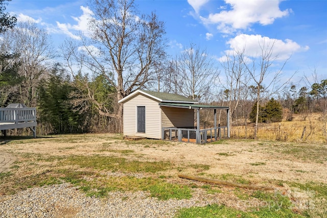 view of outbuilding with a yard