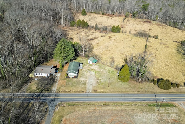 birds eye view of property featuring a rural view