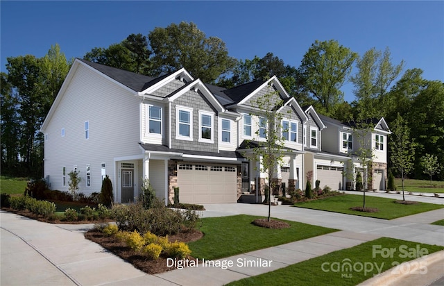 view of front of house with a garage and a front lawn