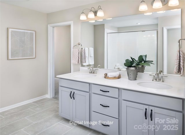 bathroom featuring tile patterned floors, vanity, and an enclosed shower