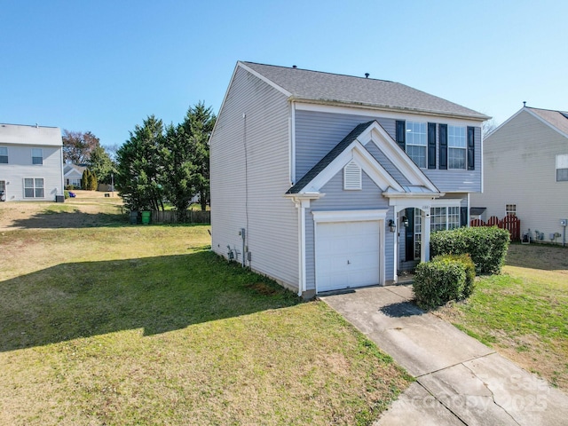 view of front of property with a garage and a front lawn