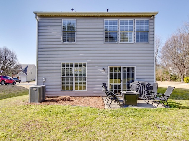 back of house with a yard, a patio, and central air condition unit