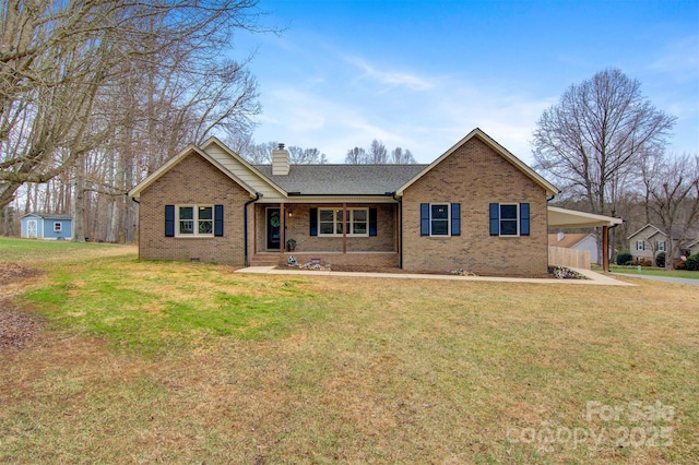 single story home with a shed, a front lawn, a carport, and a porch