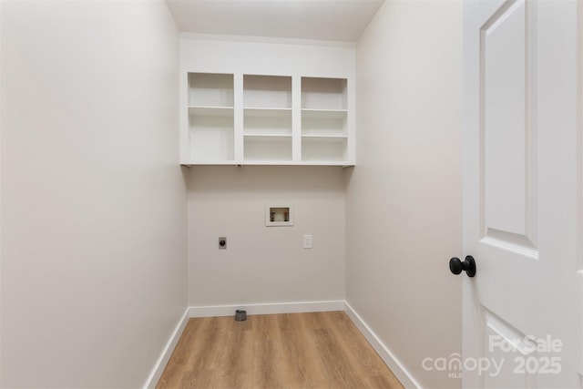 laundry room featuring electric dryer hookup, hookup for a washing machine, and light hardwood / wood-style floors