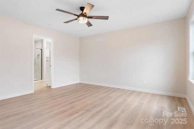 empty room featuring ceiling fan and light wood-type flooring