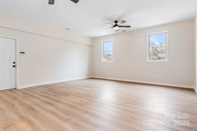 spare room with light hardwood / wood-style floors and ceiling fan