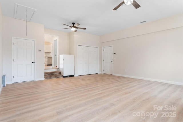 unfurnished living room with ceiling fan and light hardwood / wood-style floors