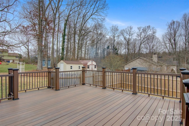 wooden terrace featuring a storage unit