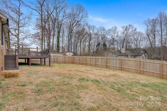 view of yard featuring a wooden deck