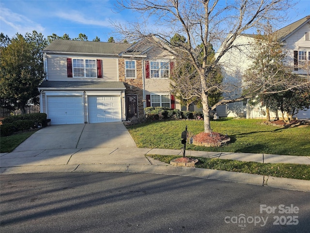 view of front property with a garage and a front yard