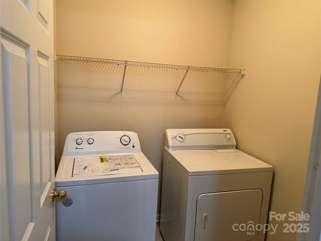 laundry area featuring washing machine and dryer