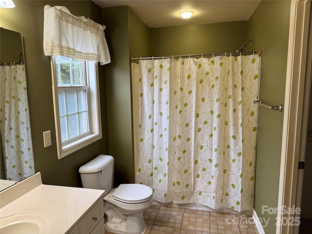 full bathroom with vanity, shower / bath combination with curtain, and toilet