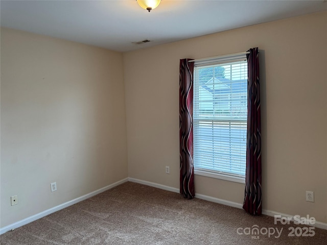 spare room with carpet flooring