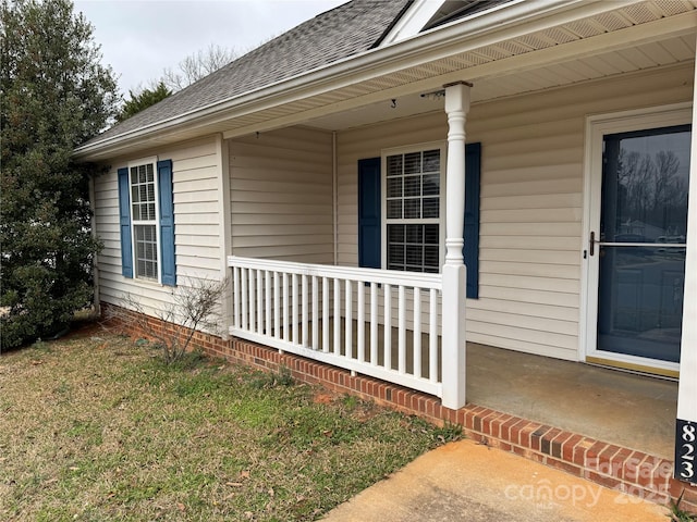 doorway to property featuring covered porch