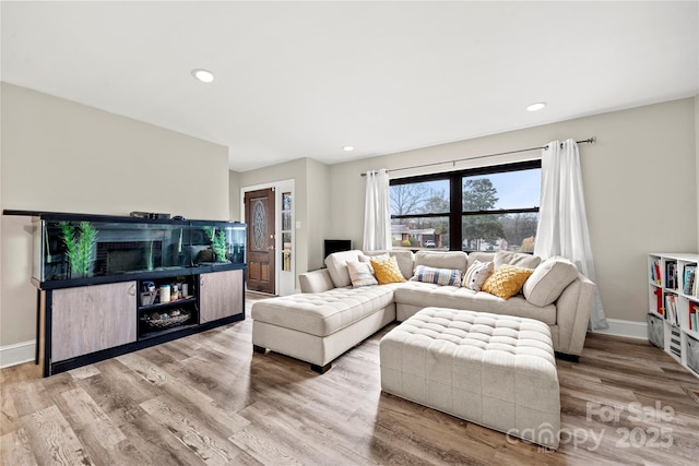 living room with light hardwood / wood-style floors