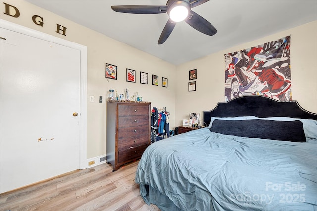 bedroom featuring light hardwood / wood-style floors and ceiling fan