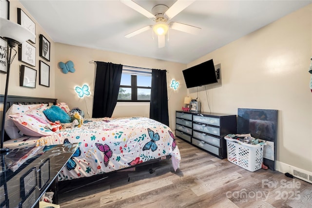 bedroom featuring ceiling fan and wood-type flooring